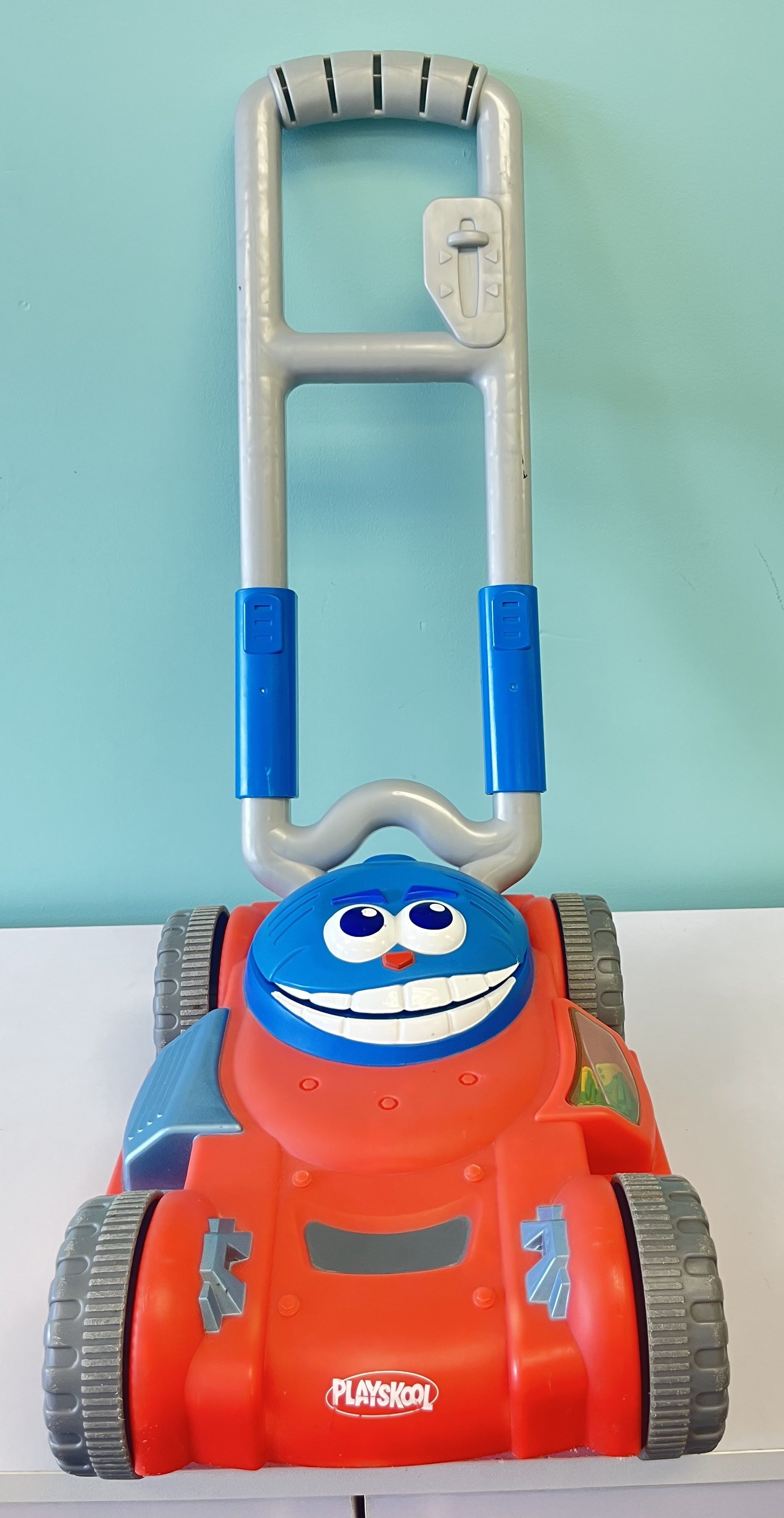 Red and Blue Lawn Mower
